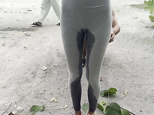Crazy girl wetting her leggings in public